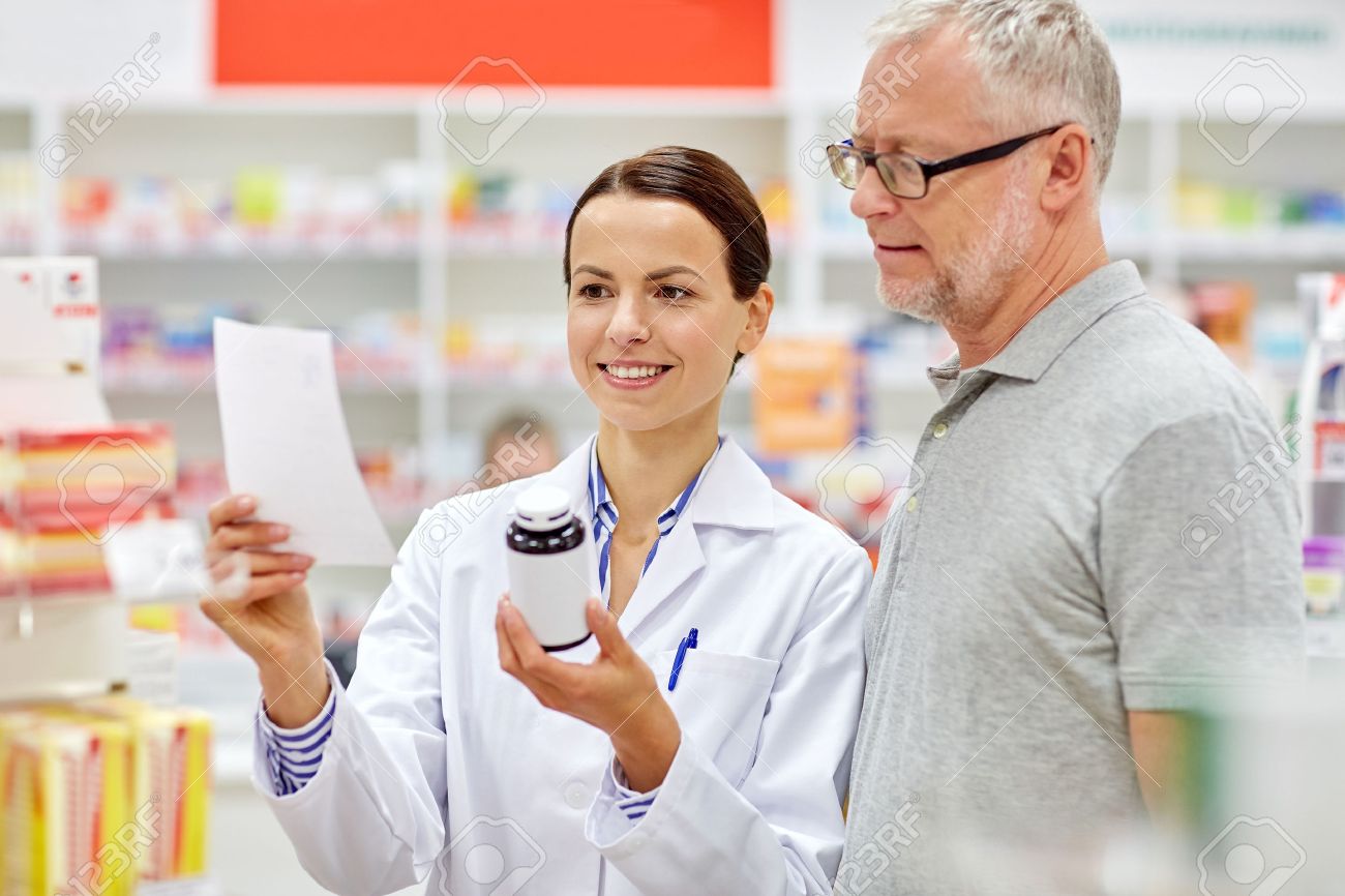 medicine, pharmaceutics, health care and people concept - happy pharmacist and senior man customer with drug and prescription at drugstore - 54776685 medicine, pharmaceutics, health care and people concept - happy pharmacist and senior man customer with drug and prescription at drugstore - 54776685