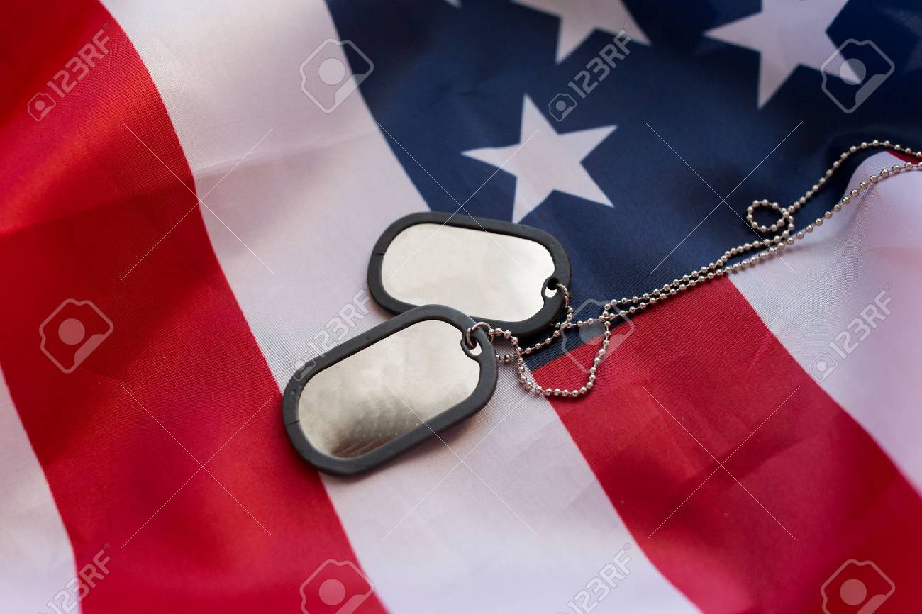 military forces, military service, patriotism and nationalism concept - close up of american flag and soldiers badges - 62832631 military forces, military service, patriotism and nationalism concept - close up of american flag and soldiers badges - 62832631