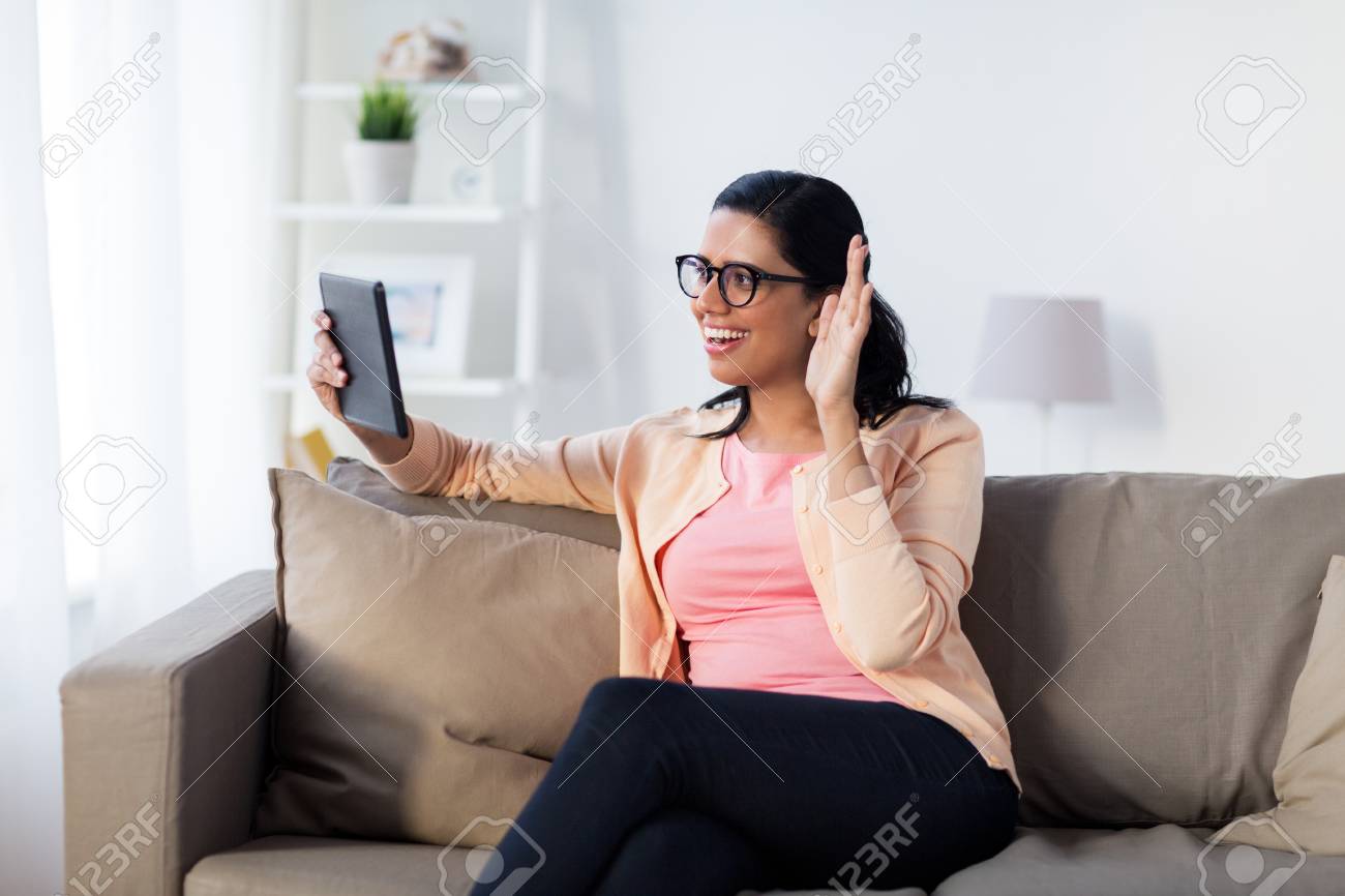 People Technology And Leisure Concept Happy Young Indian Woman Stock Photo Picture And Royalty Free Image Image 76883590