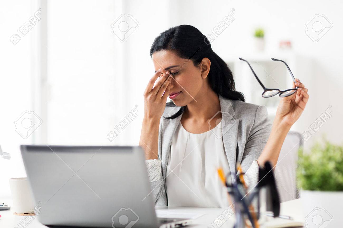 Business, Overwork, Deadline, Vision And People Concept - Tired  Businesswoman In Glasses Working At Office And Rubbing Eyes Stock Photo,  Picture and Royalty Free Image. Image 76883599.