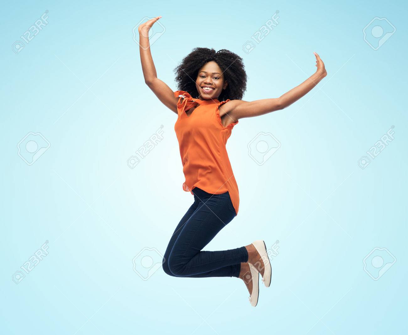 Little Africanamerican Girl Jumping Over Studio Background Stock Photo - Download Image Now - iStock