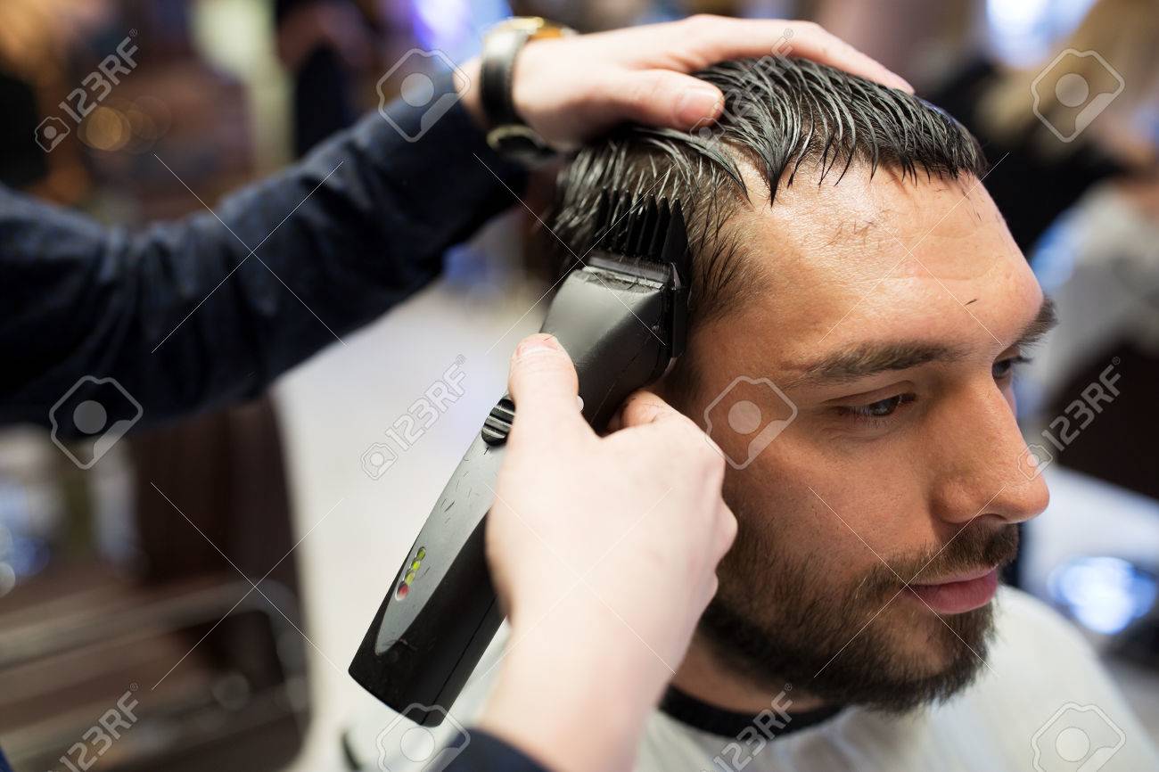 Grooming Hairstyle And People Concept Man And Barber Or