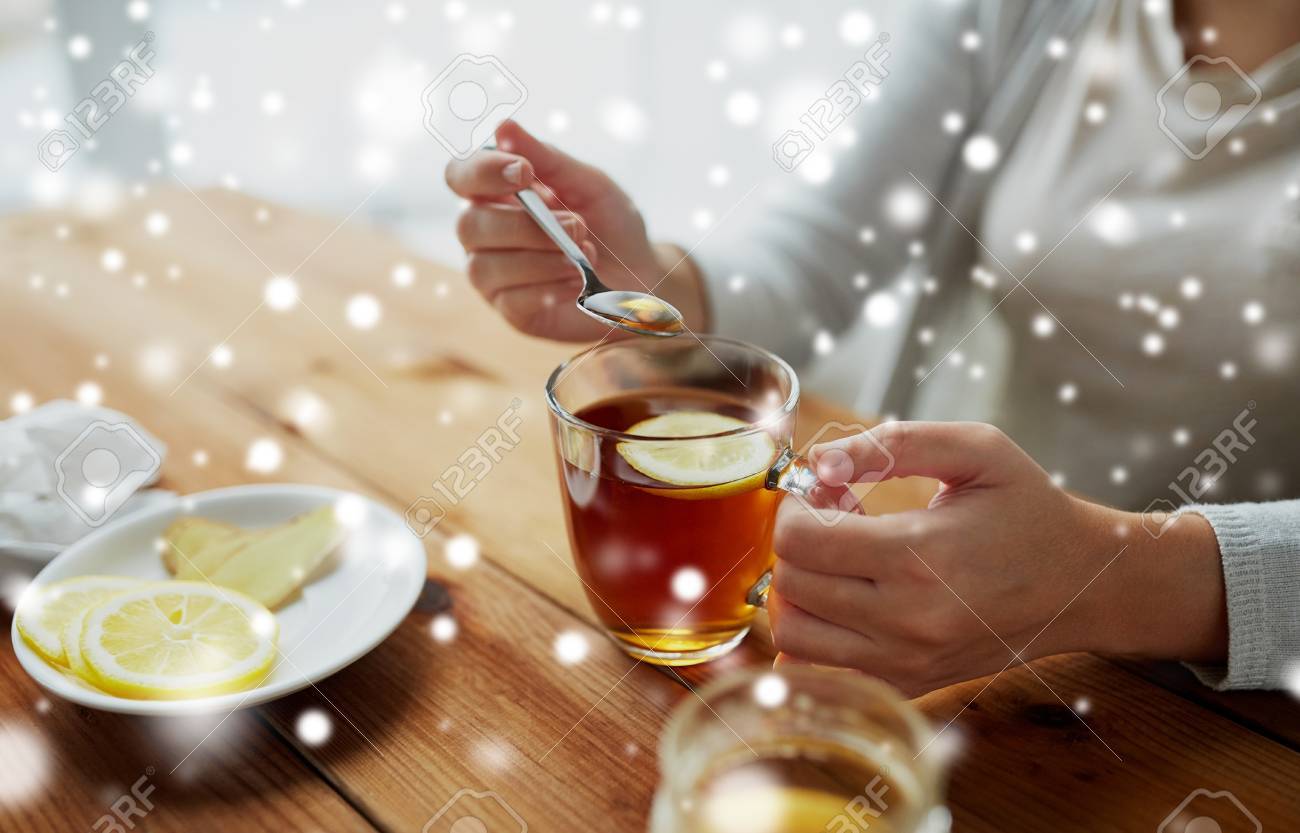 Close Up Of Woman Adding Honey To Tea With Lemon Stock Photo Picture And Royalty Free Image Image 88396454