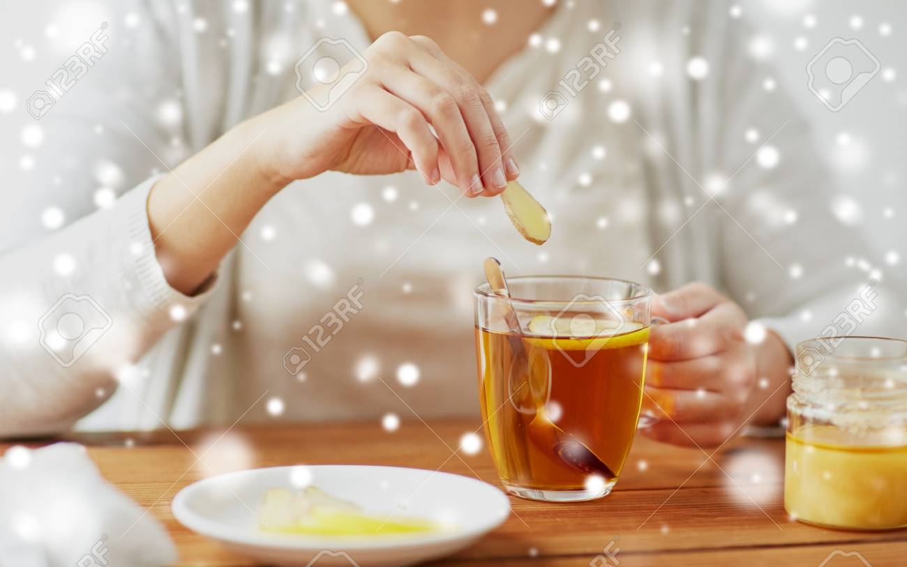 Close Up Of Woman Adding Honey To Tea With Lemon Stock Photo Picture And Royalty Free Image Image 89289872