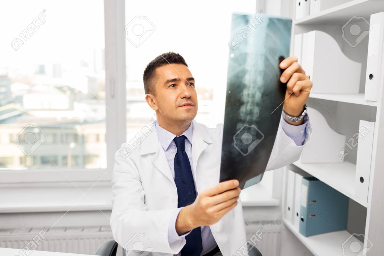 doctor with x-ray scan at hospital - 115184831 doctor with x-ray scan at hospital - 115184831