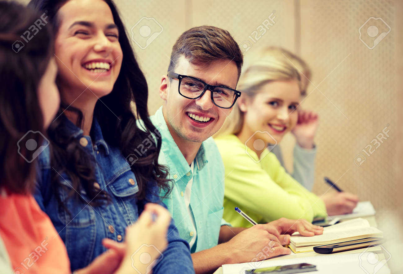 education, high school, university, vision and people concept - young man in eyeglasses with group of students at lecture - 120267752 education, high school, university, vision and people concept - young man in eyeglasses with group of students at lecture - 120267752