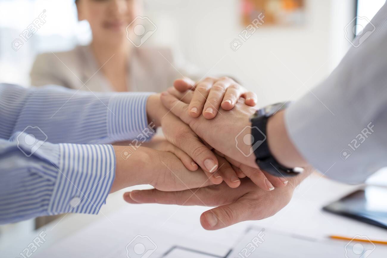 close up of business team stacking hands - 124633844 close up of business team stacking hands - 124633844