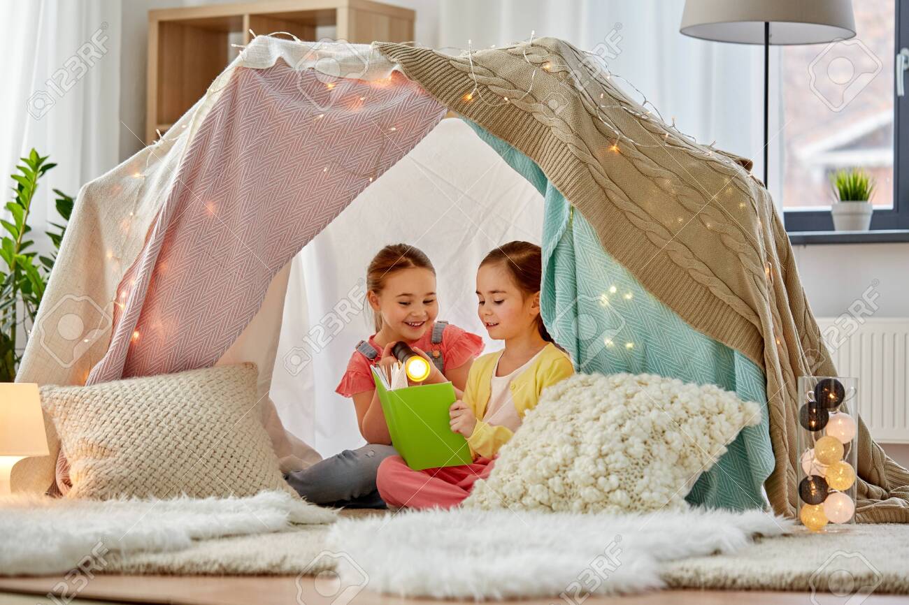 girls reading tent