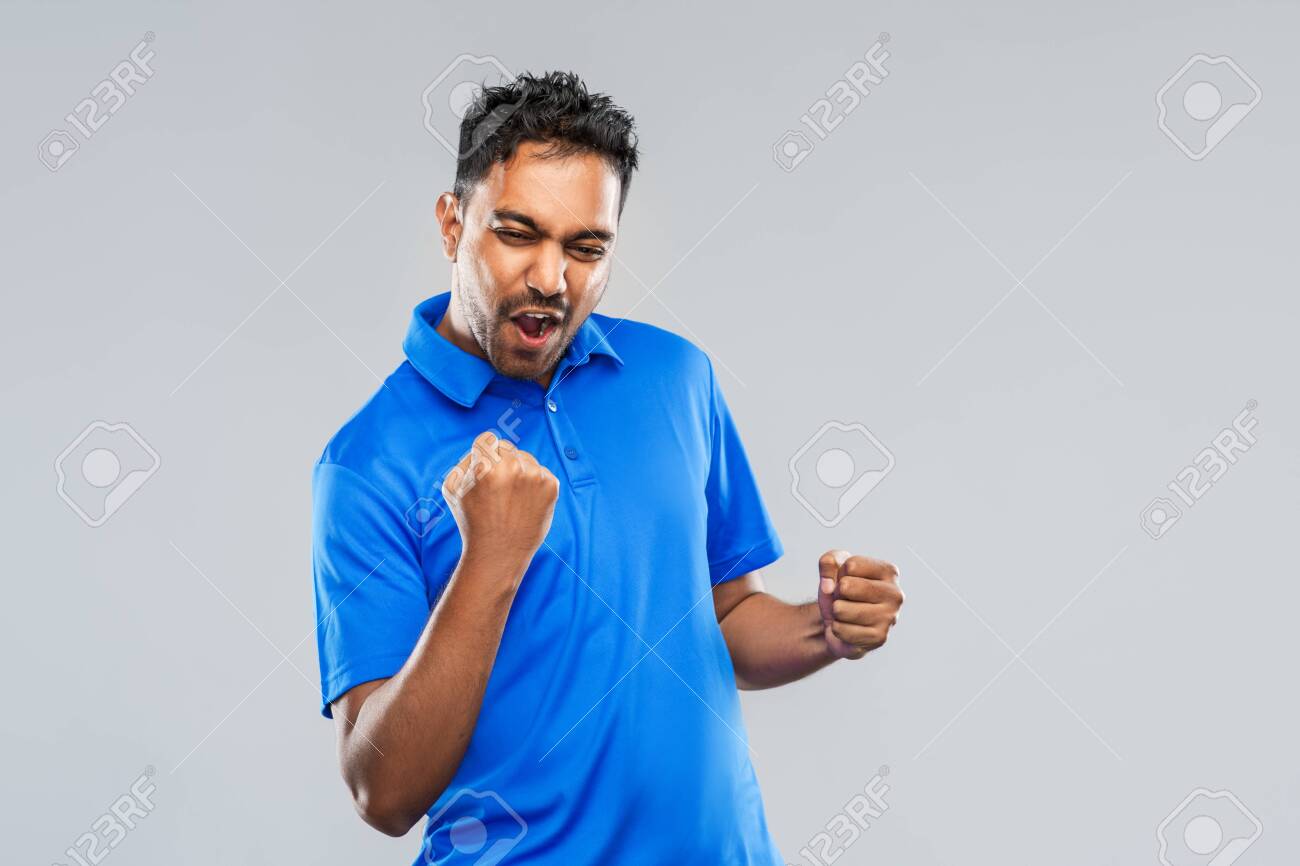 happy indian man celebrating victory - 130497160 happy indian man celebrating victory - 130497160