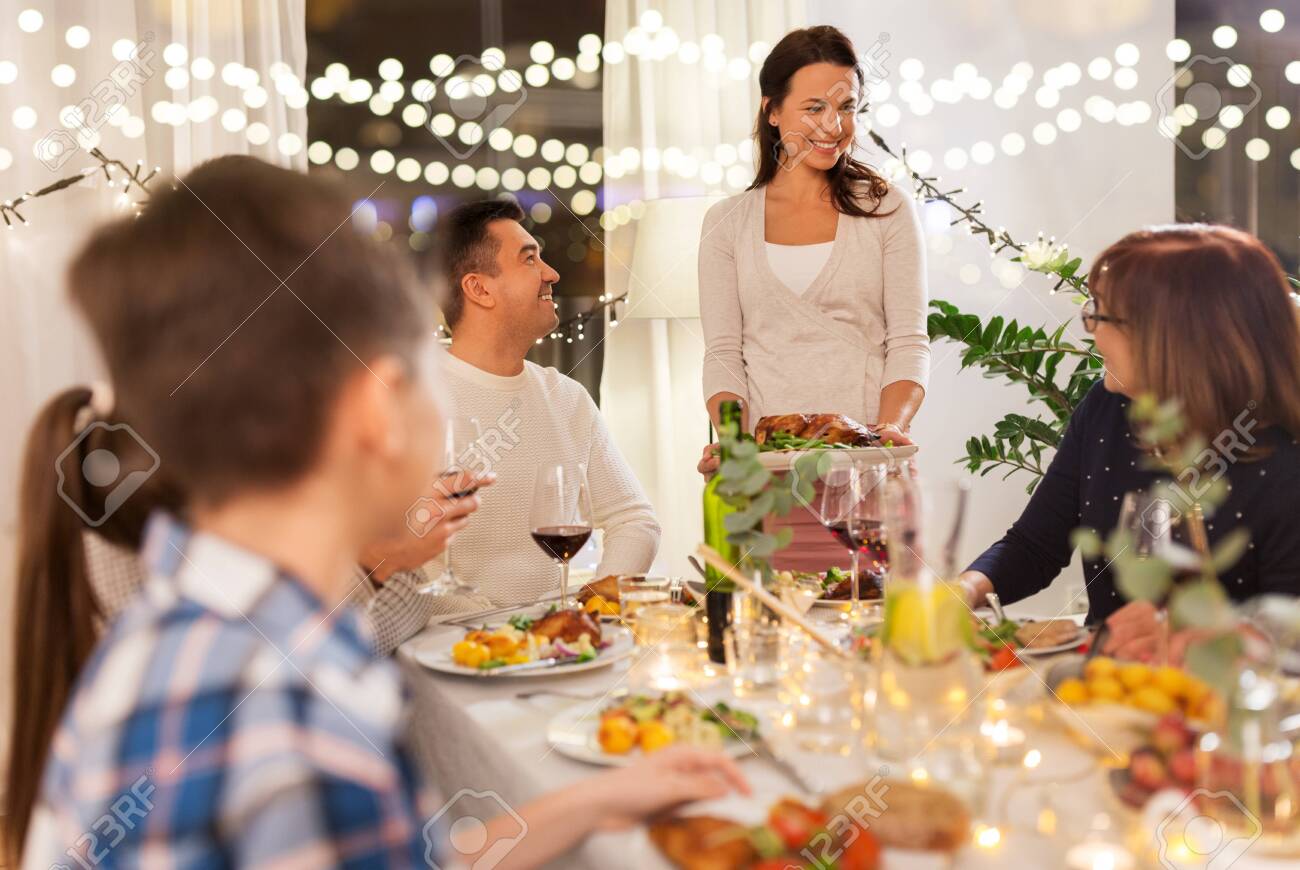 happy family having dinner party at home - 130745180 happy family having dinner party at home - 130745180