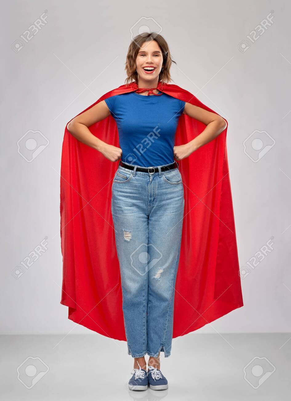 women's power and people concept - happy woman in red superhero cape over grey background - 132997226 women's power and people concept - happy woman in red superhero cape over grey background - 132997226
