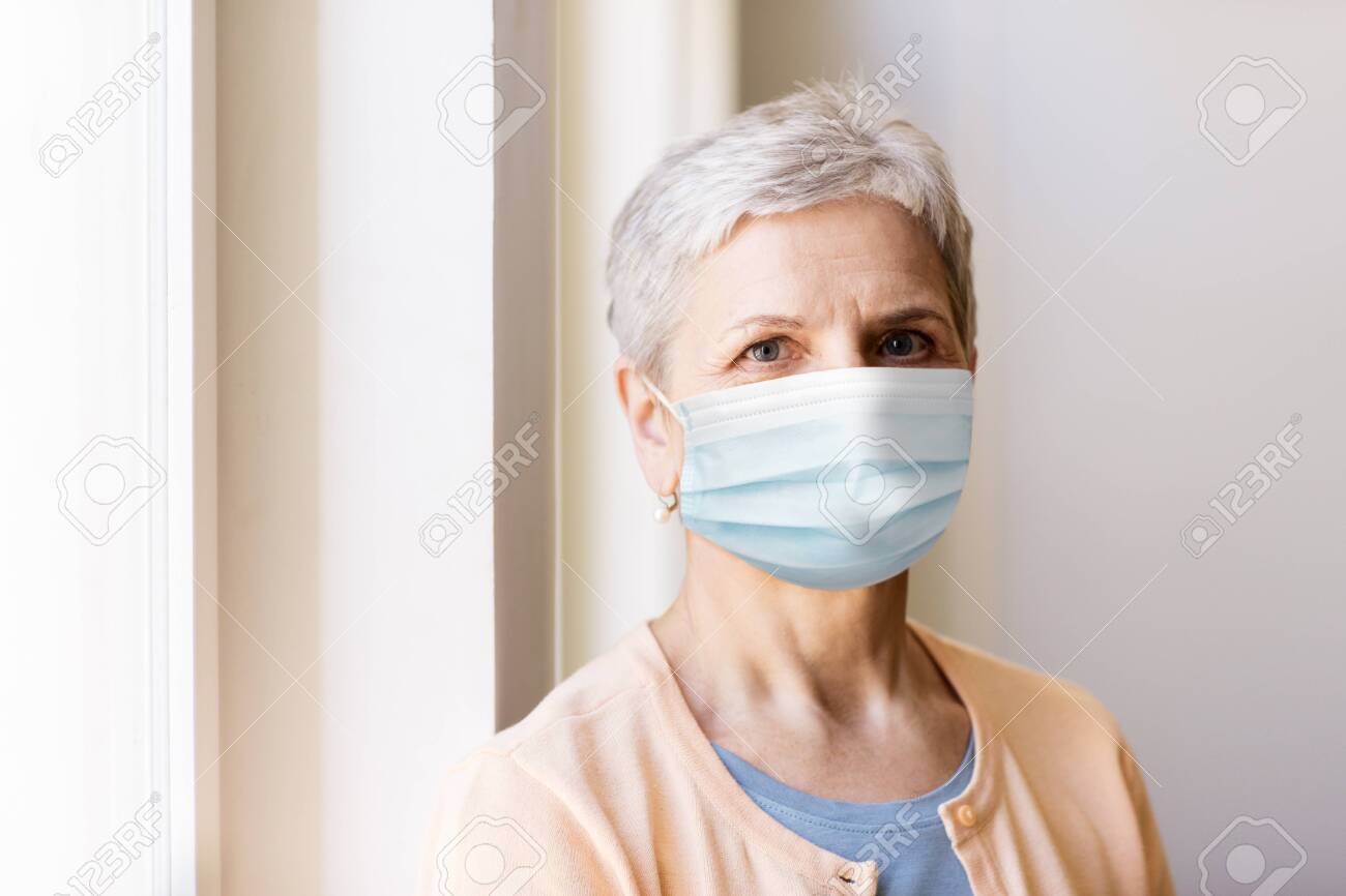 senior woman in protective medical mask - 142653985 senior woman in protective medical mask - 142653985