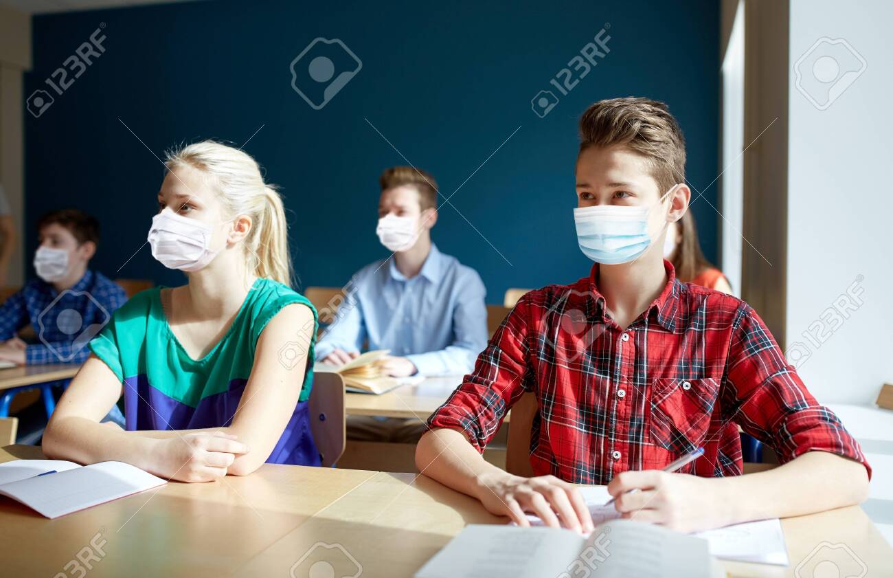 group of students in masks at school lesson - 147446135 group of students in masks at school lesson - 147446135