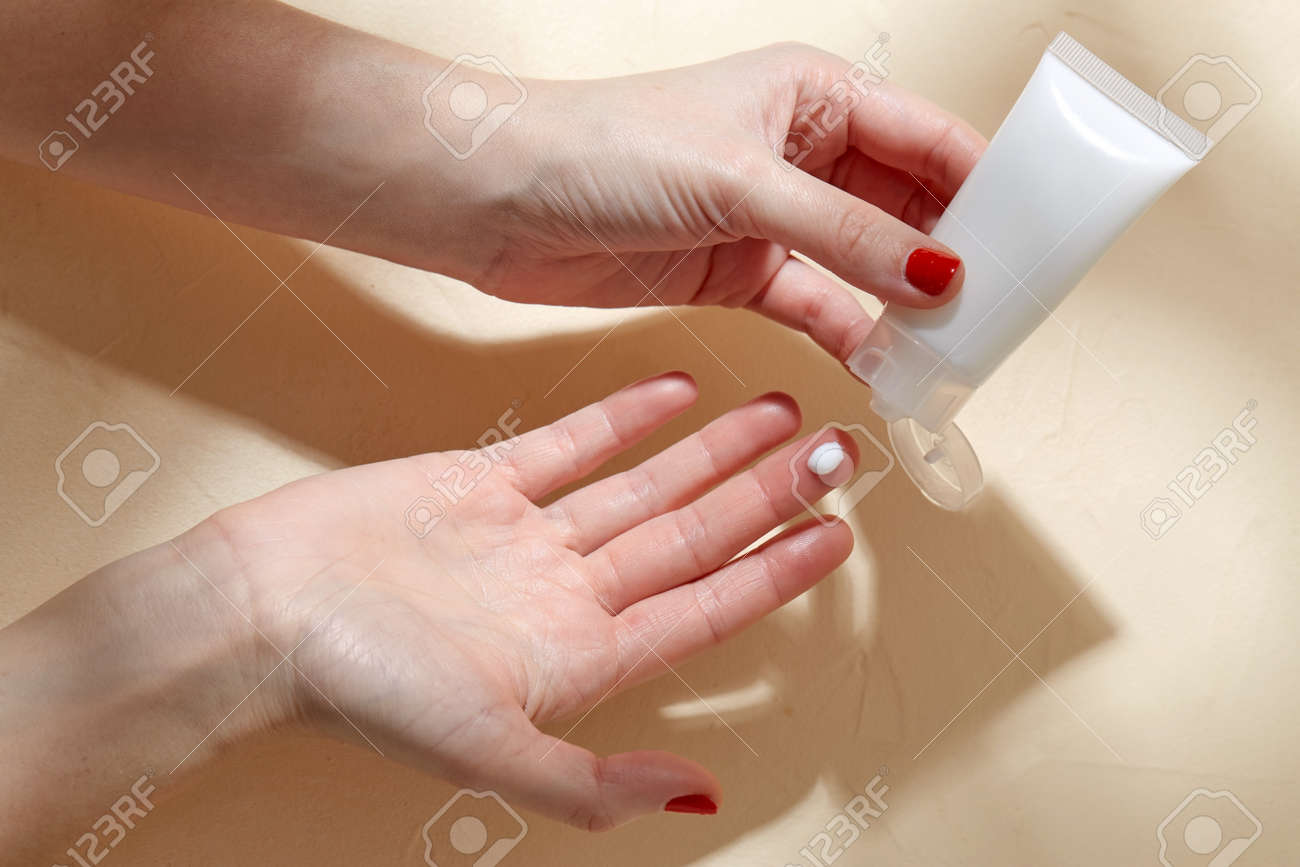 female hands applying moisturizer to skin - 169967156 female hands applying moisturizer to skin - 169967156