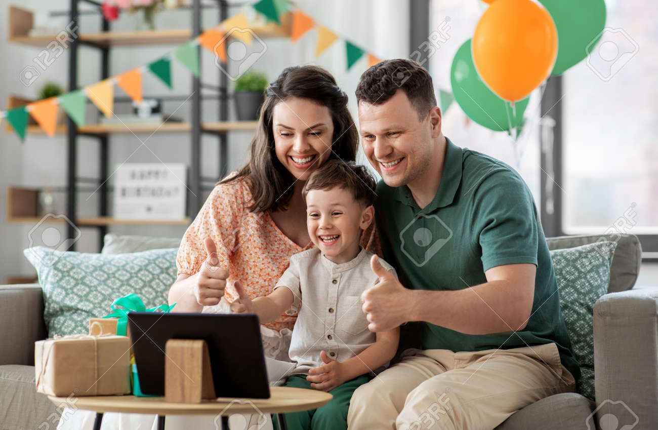 family with tablet pc has video call on birthday - 169968231 family with tablet pc has video call on birthday - 169968231