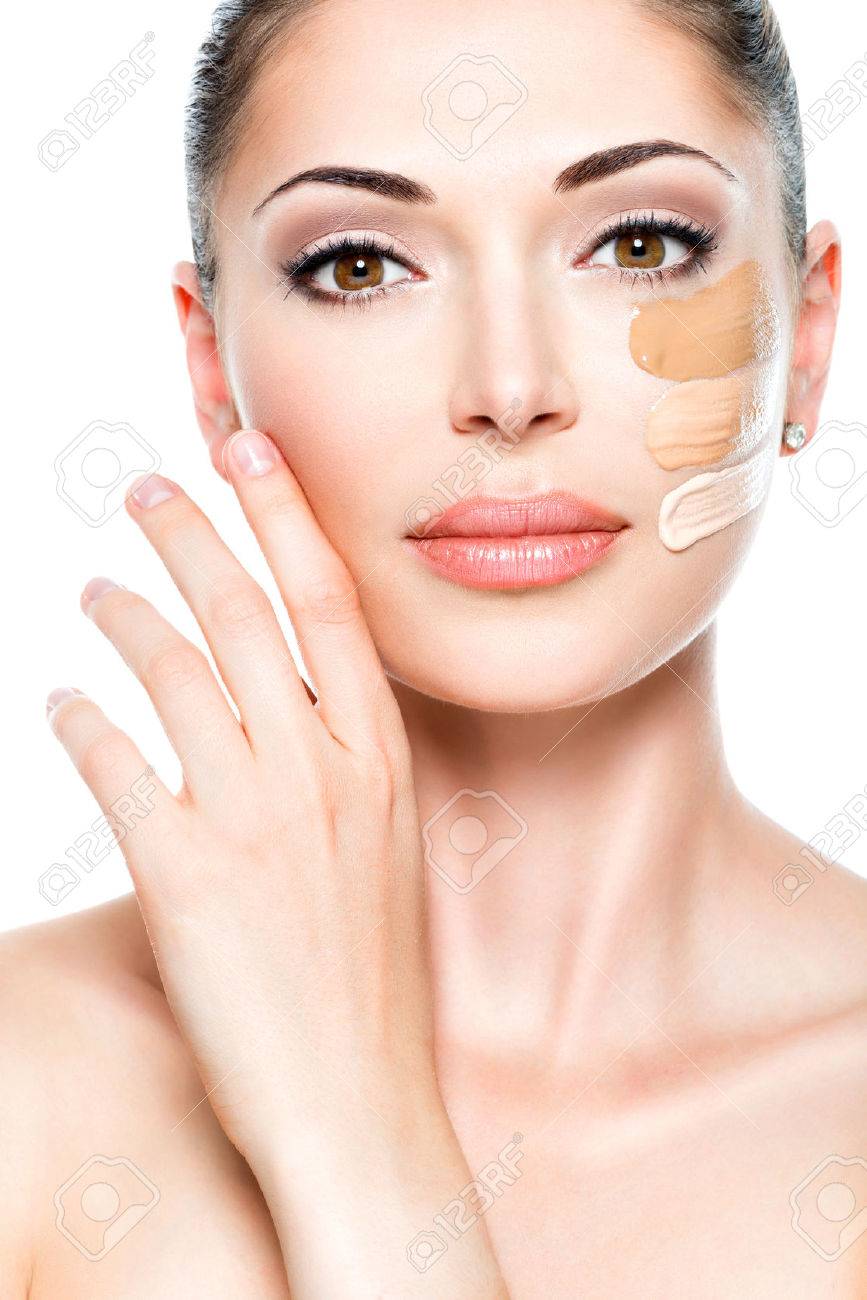 Beautiful face of young woman with cosmetic foundation on a skin. Beauty treatment concept - 53558984 Beautiful face of young woman with cosmetic foundation on a skin. Beauty treatment concept - 53558984