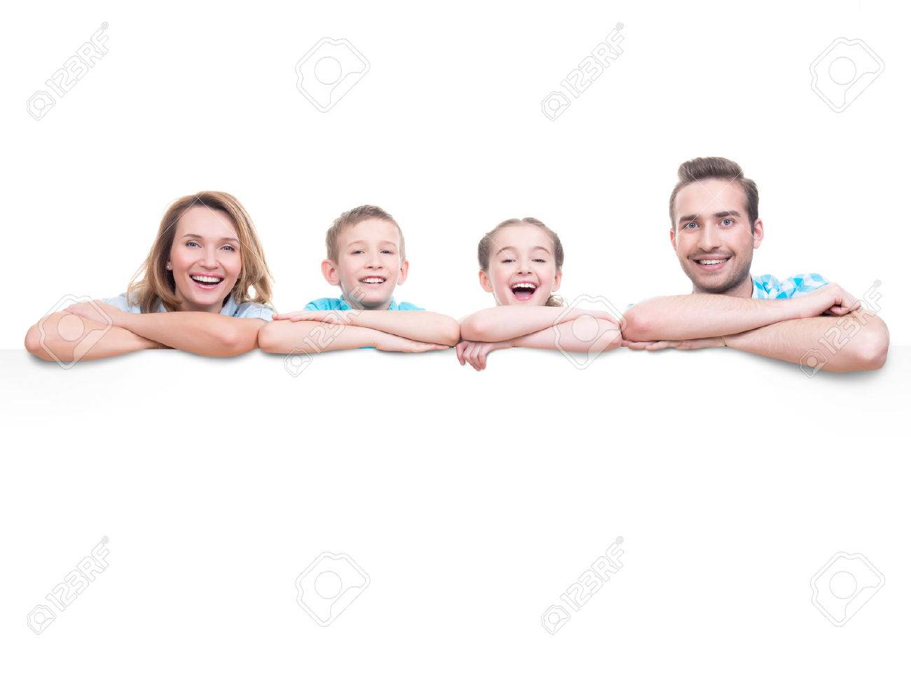 Young family with a banner - isolated on a white background - 63986529 Young family with a banner - isolated on a white background - 63986529
