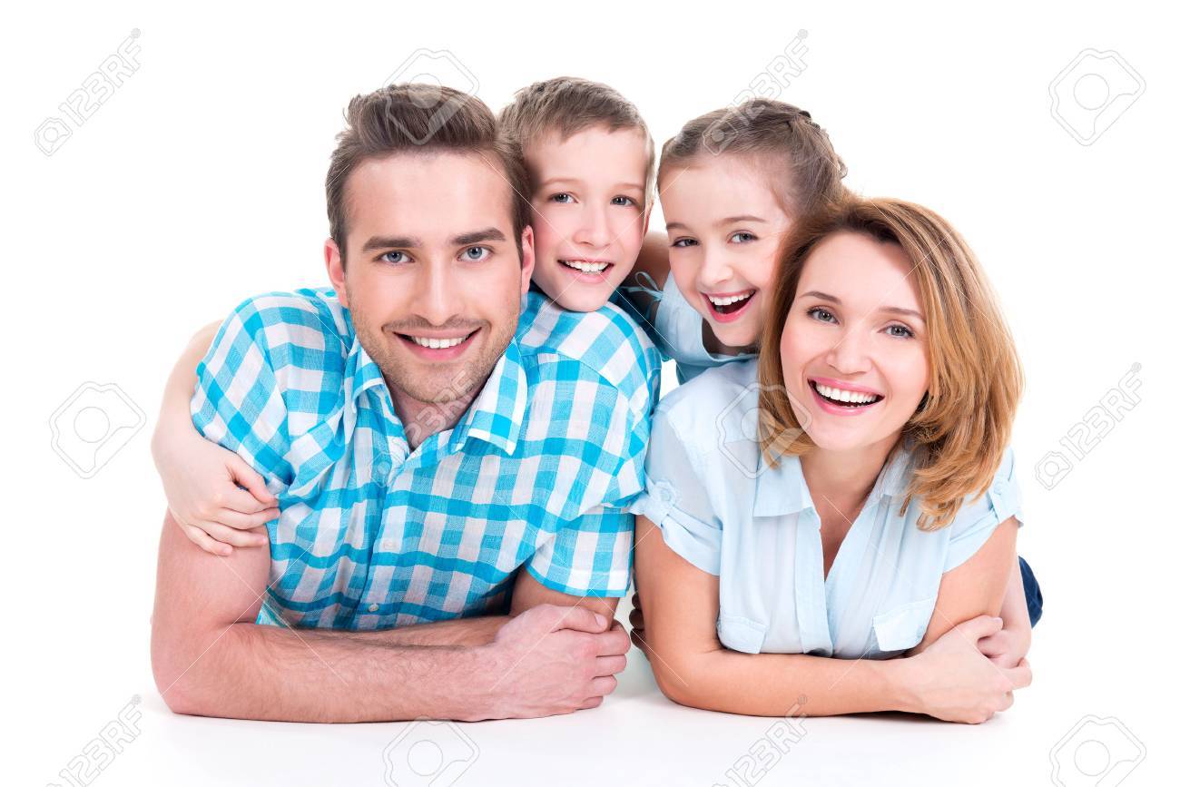 Caucasian happy smiling young family with two children lying down on the floor - 62833658 Caucasian happy smiling young family with two children lying down on the floor - 62833658