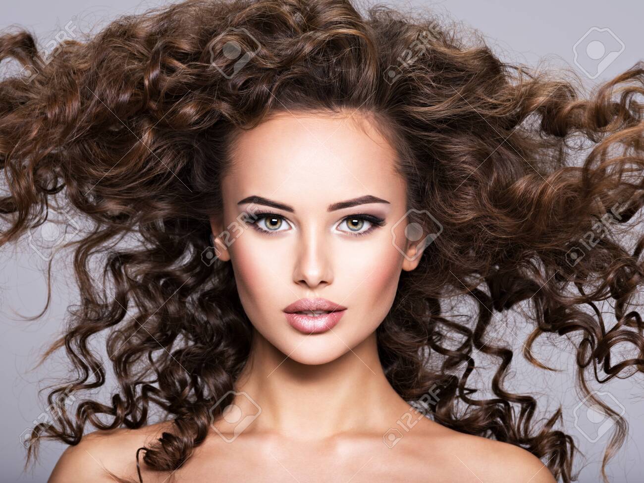 Woman With Long Bown Curly Hair. Portrait Of A Beautiful Brunette Sexy Girl With Long Hair Stock Photo, Picture And Royalty Free Image. Image 139477250. Woman With Long Bown Curly Hair. Portrait Of A Beautiful Brunette Sexy Girl With Long Hair Stock Photo, Picture And Royalty Free Image. Image 139477250.