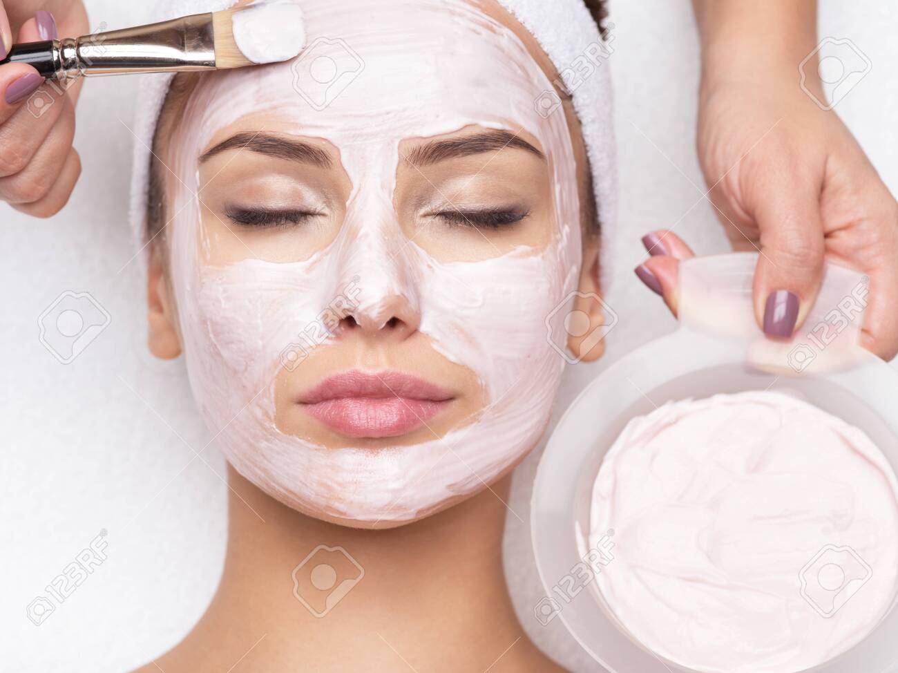 Download Young Beautiful Woman Receiving Facial Mask In Spa Beauty Salon Stock Photo Picture And Royalty Free Image Image 139390835 Yellowimages Mockups