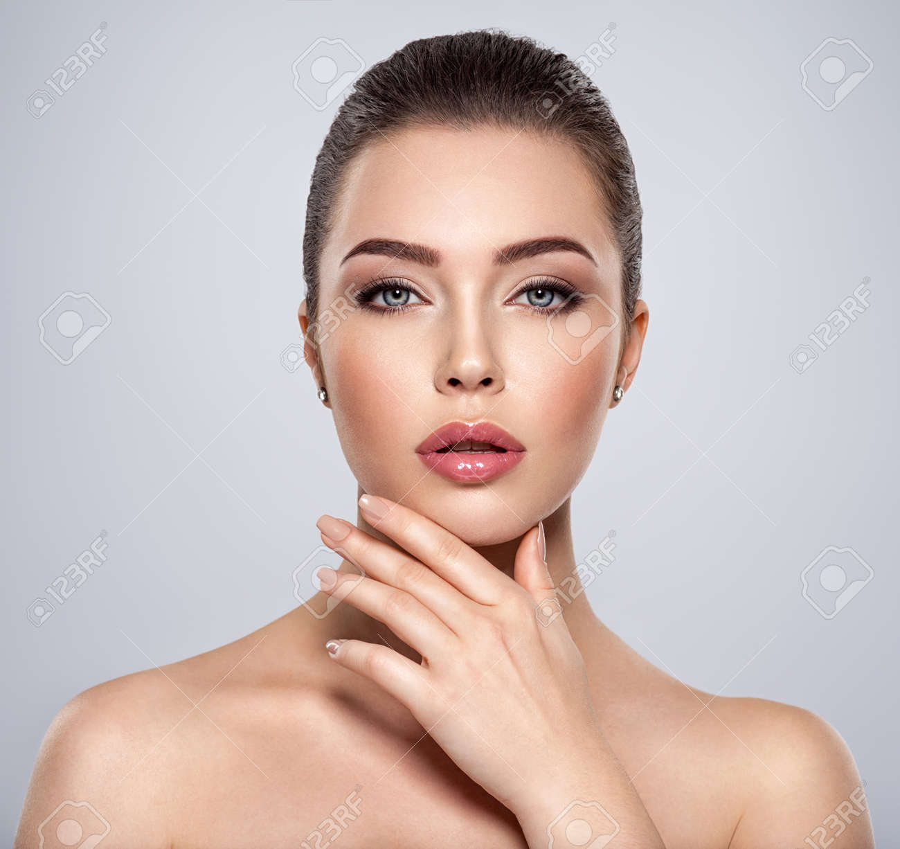 Front portrait of the woman with beauty face - isolated. Beauty face of the young beautiful girl with a healthy skin. Closeup portrait of an attractive female with a beautiful eyes. Skin care concept. - 157677506 Front portrait of the woman with beauty face - isolated. Beauty face of the young beautiful girl with a healthy skin. Closeup portrait of an attractive female with a beautiful eyes. Skin care concept. - 157677506