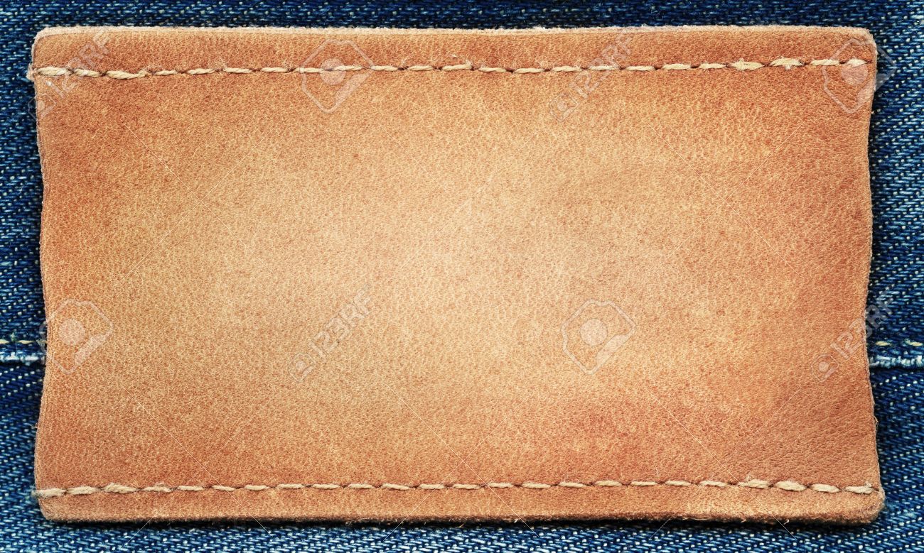 blank leather jeans label sewed on a blue jeans stock photo picture