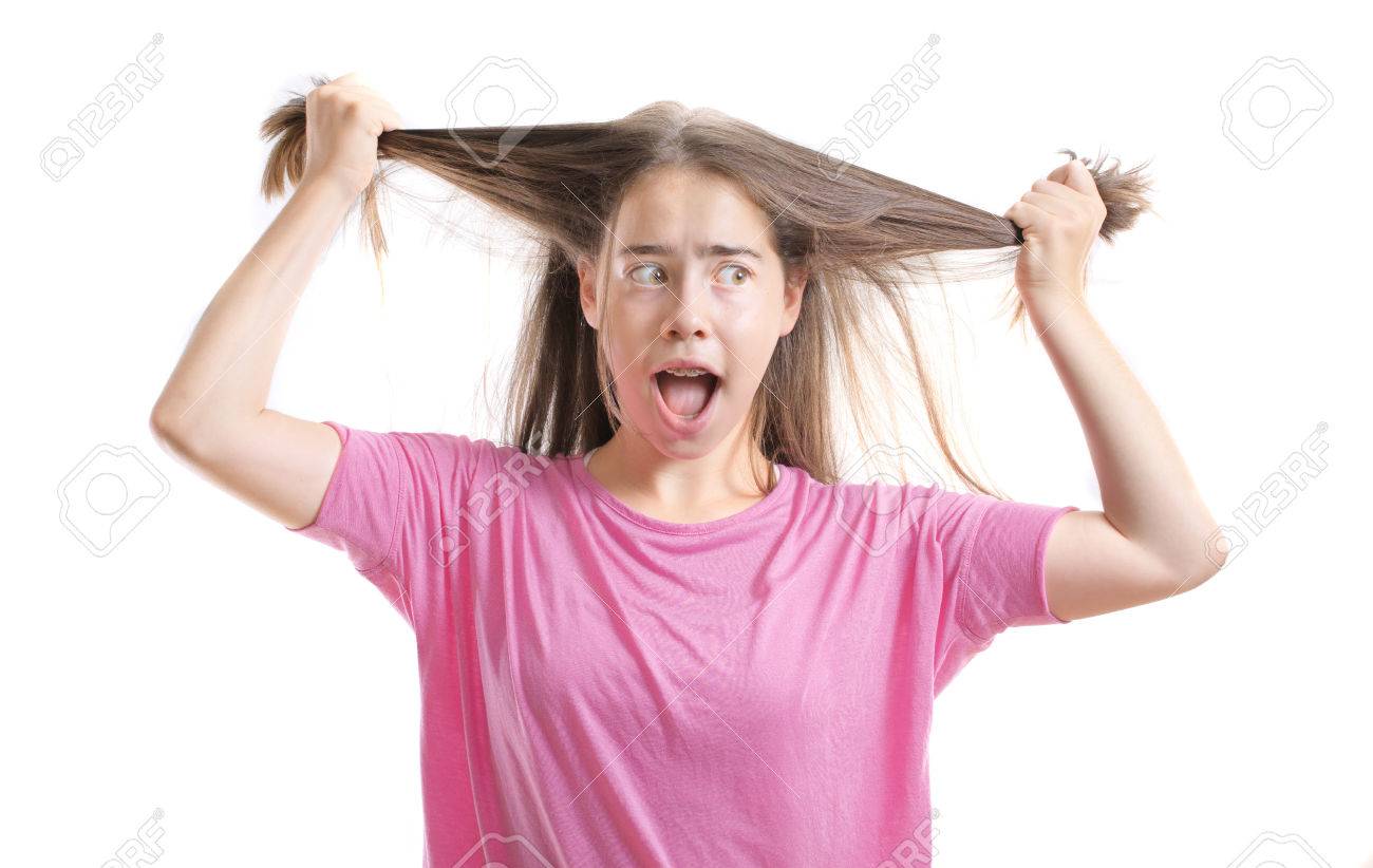 A 13 Year Old Teenage Girl With Braces On Her Teeth Pulling Out Her Hair In  Frustration Stock Photo, Picture and Royalty Free Image. Image 43650100., image size:1300x822
