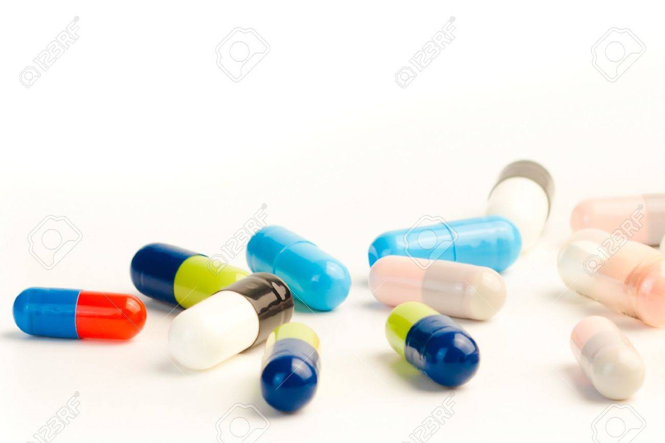 detail of many colorful pills on white background with space for text - 11585919 detail of many colorful pills on white background with space for text - 11585919