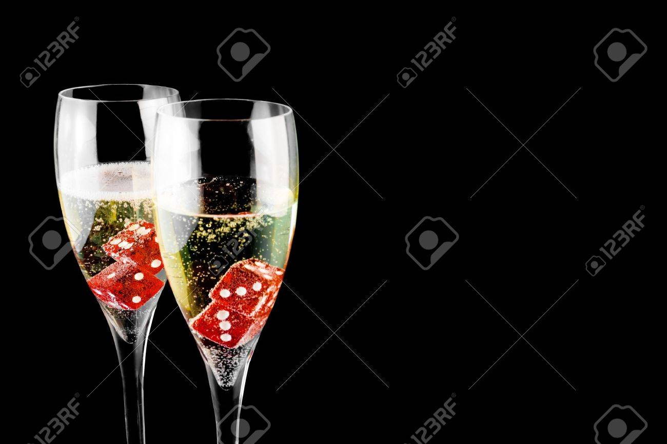 red dice in a champagne flute on black background - 11781951 red dice in a champagne flute on black background - 11781951