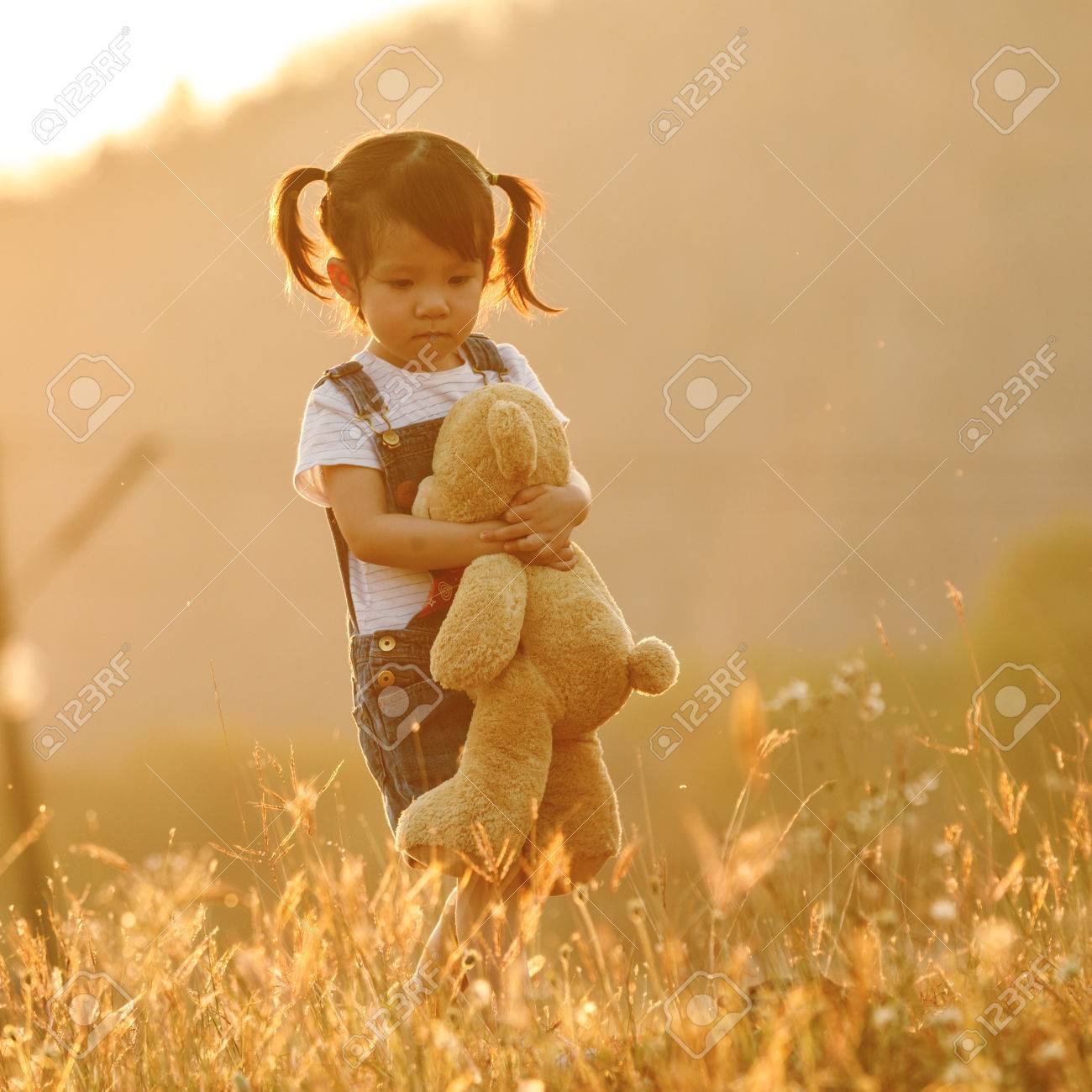 Sad Little Girl Feeling Alone In The Park Concept. Lonely ...