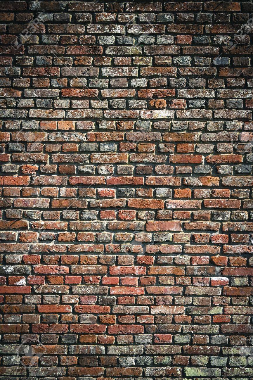 close up detail fo old red brick wall side of building in uk stock