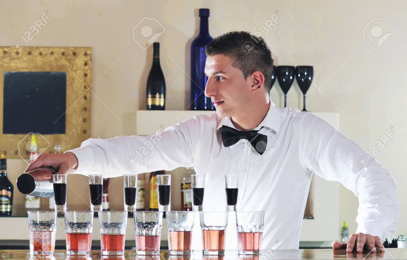 pro barman prepare coctail drink and representing nightlife and pro bartender