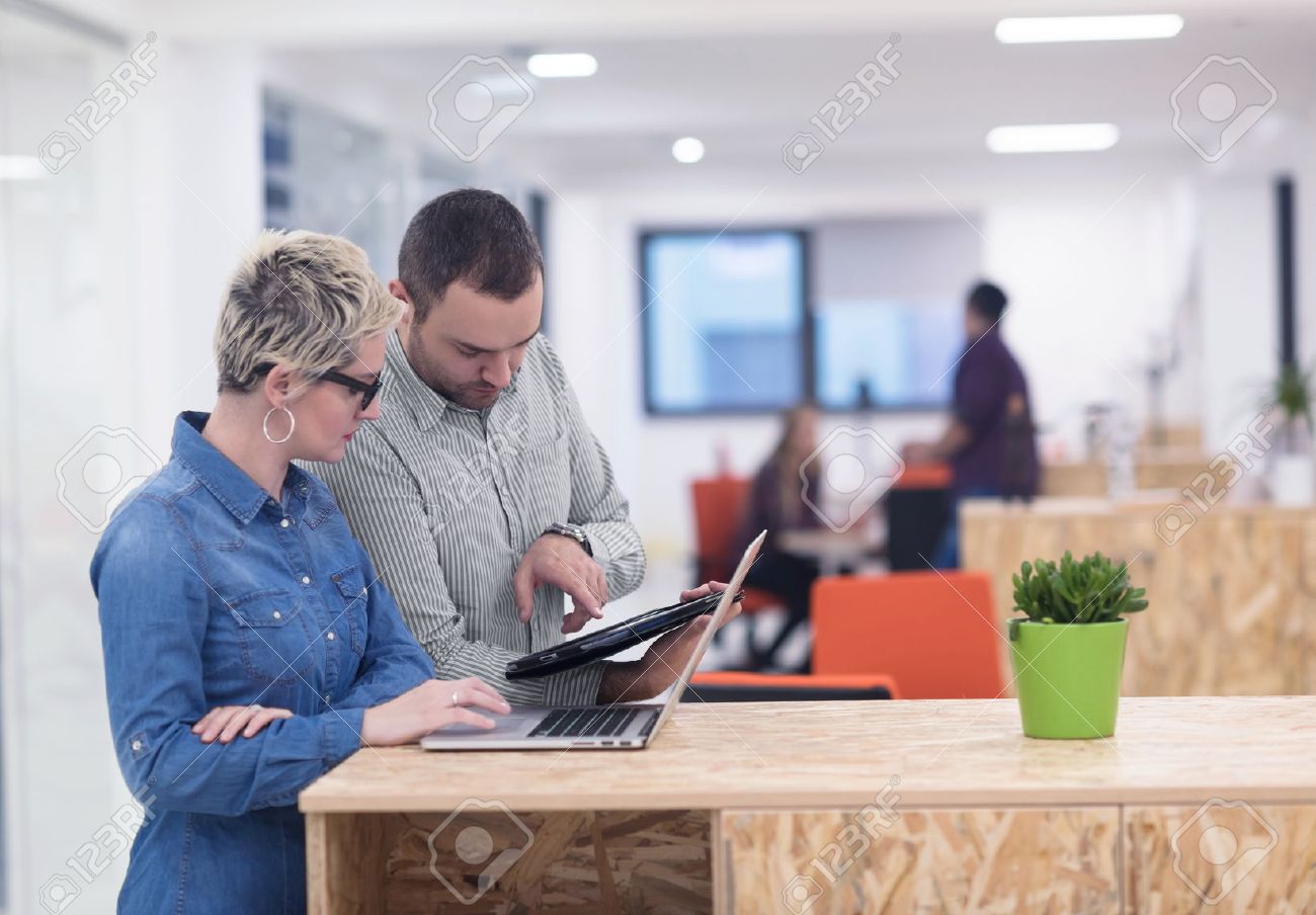 startup business team on meeting in modern bright office interior brainstorming, working on laptop and tablet computer - 52953453 startup business team on meeting in modern bright office interior brainstorming, working on laptop and tablet computer - 52953453