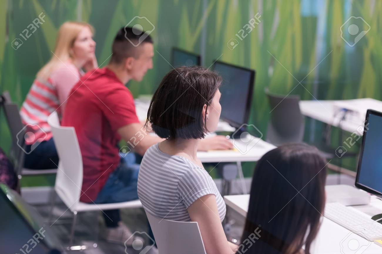 handsome mature teacher and students in computer lab classroom - 57223532 handsome mature teacher and students in computer lab classroom - 57223532