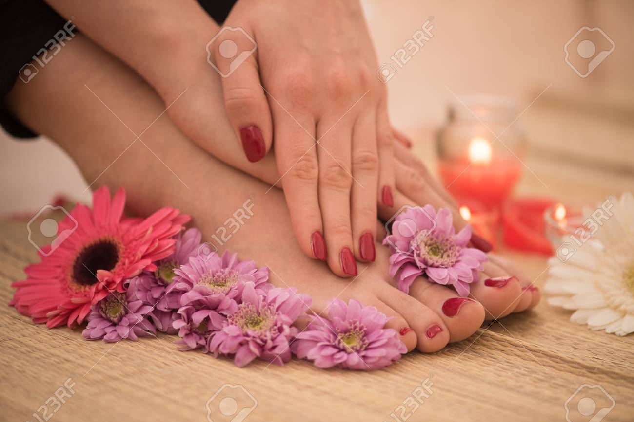 Closeup photo of a female feet and hands at spa salon on pedicure and manicure procedure - 73615938 Closeup photo of a female feet and hands at spa salon on pedicure and manicure procedure - 73615938
