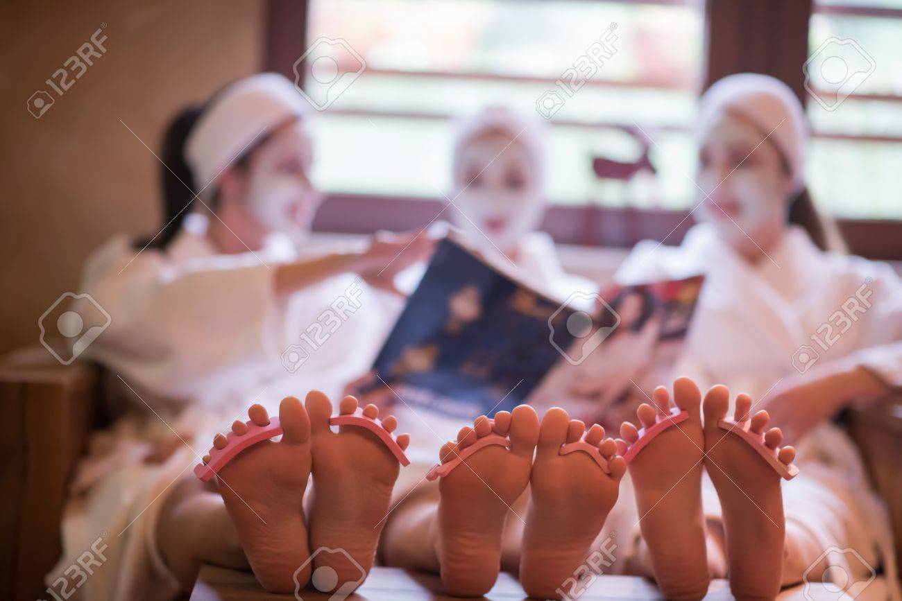 group of famale friends in spa have fun, celebrate bachelorette party with face mask - 73377587 group of famale friends in spa have fun, celebrate bachelorette party with face mask - 73377587