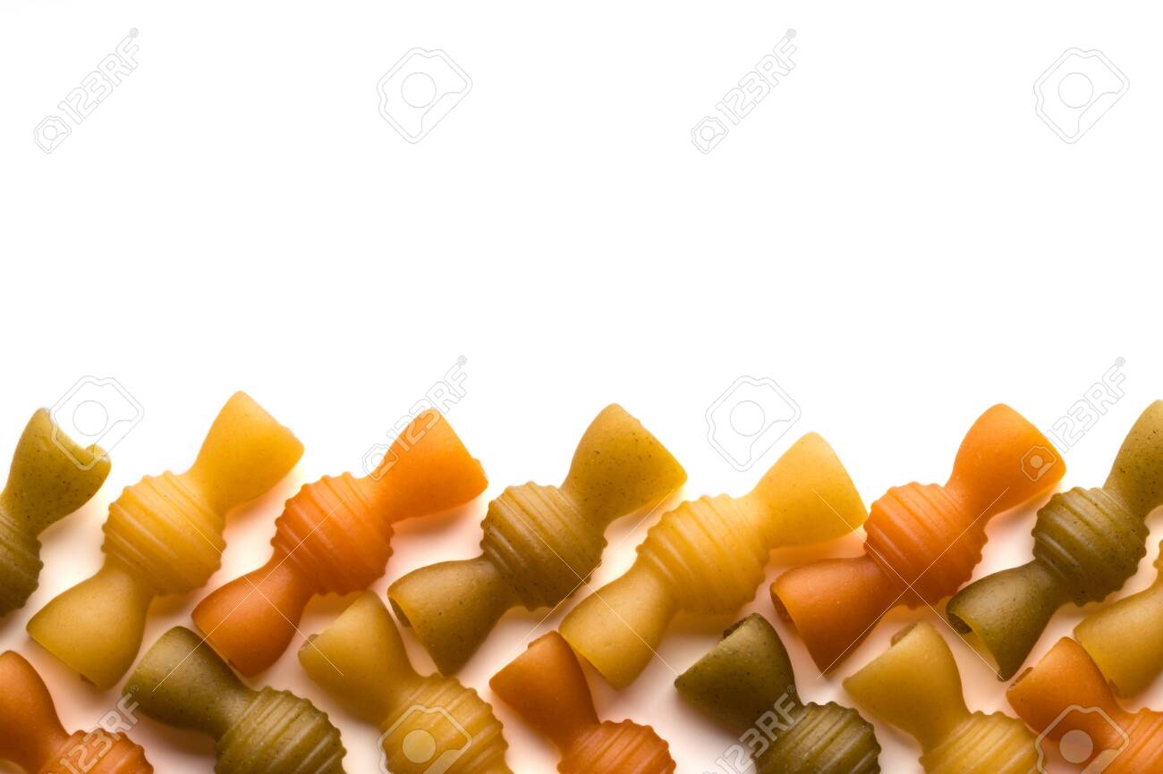 Colored italian pasta isolate on white background. Flat lay top view with space for copy. Close-up - 150426374 Colored italian pasta isolate on white background. Flat lay top view with space for copy. Close-up - 150426374