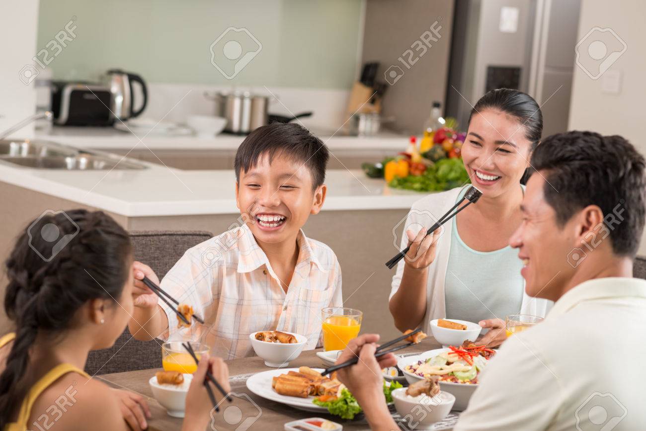 Asian people having fun at the family dinner - 73019949 Asian people having fun at the family dinner - 73019949