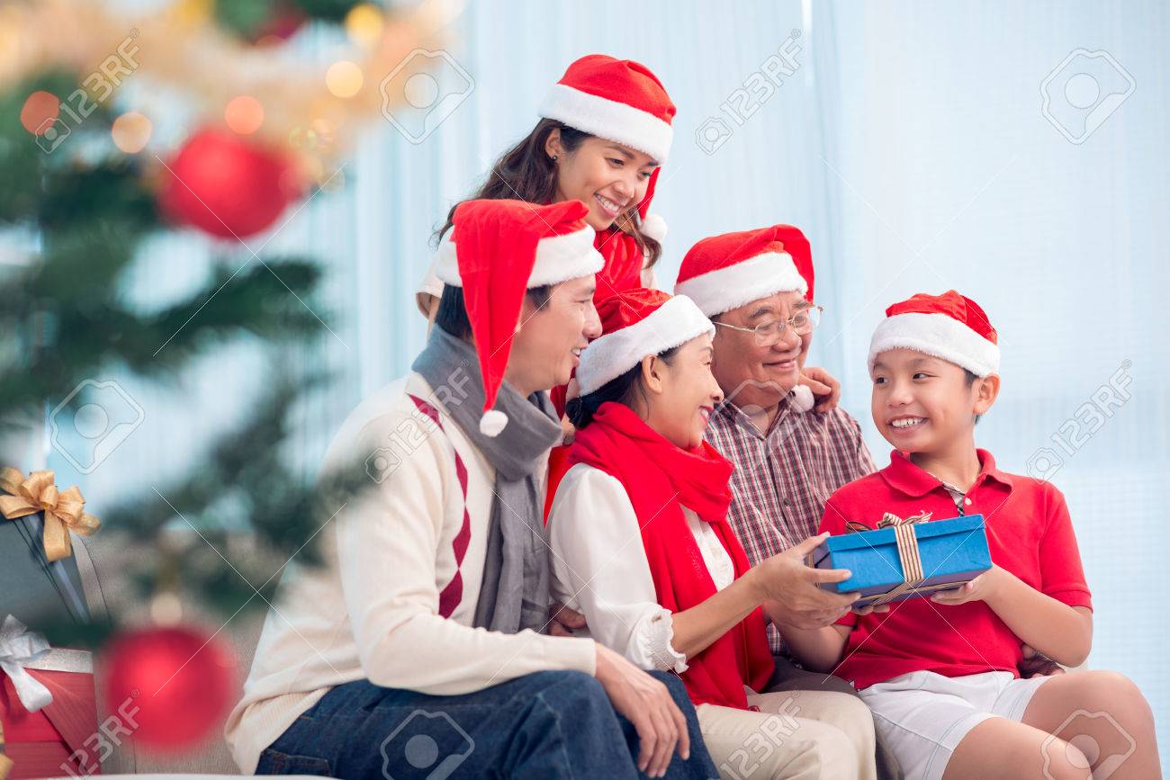 Christmas Gifts 2022 Vietnamese Happy Vietnamese Family Gathered Together To Exchange Christmas Presents  Stock Photo, Picture And Royalty Free Image. Image 73153858.