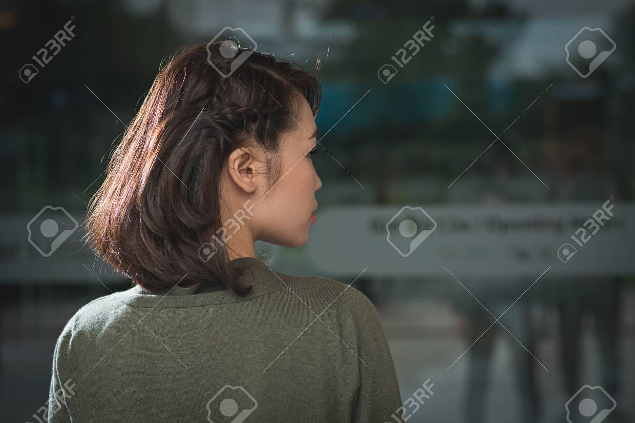 Rear View Of Young Woman With Cute Braided Hairstyle On Short