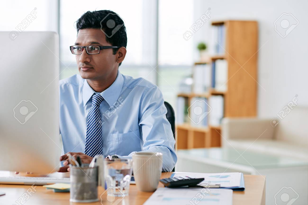 https://previews.123rf.com/images/dragonimages/dragonimages1705/dragonimages170501988/77968120-young-indian-software-developer-working-in-office.jpg