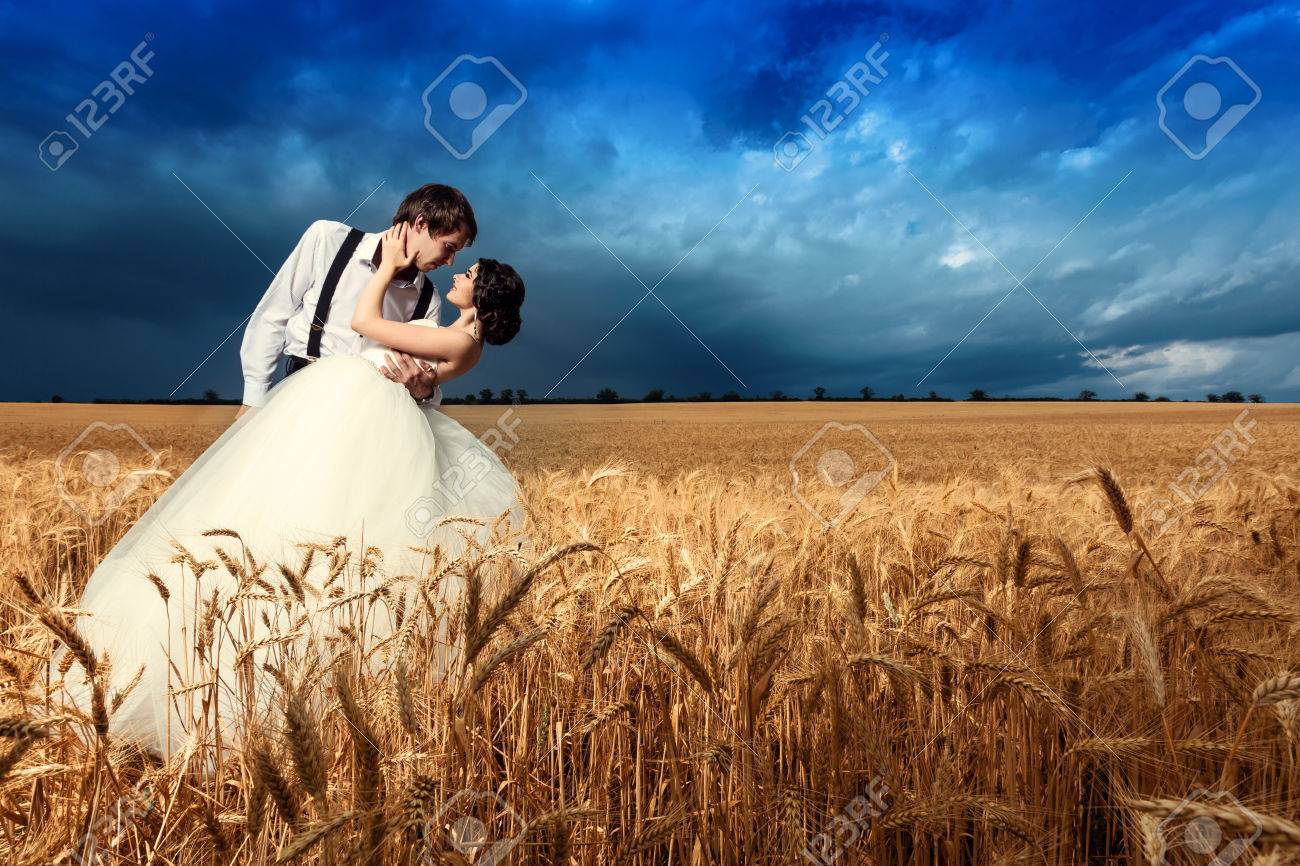 Young Couple Getting Married In Wheat Field Bride And Groom Fashion Wedding Photoshooting In Wheat Field Beautiful Vibrant Colors Happy Young Just Married Couple Stock Photo Picture And Royalty Free Image Image