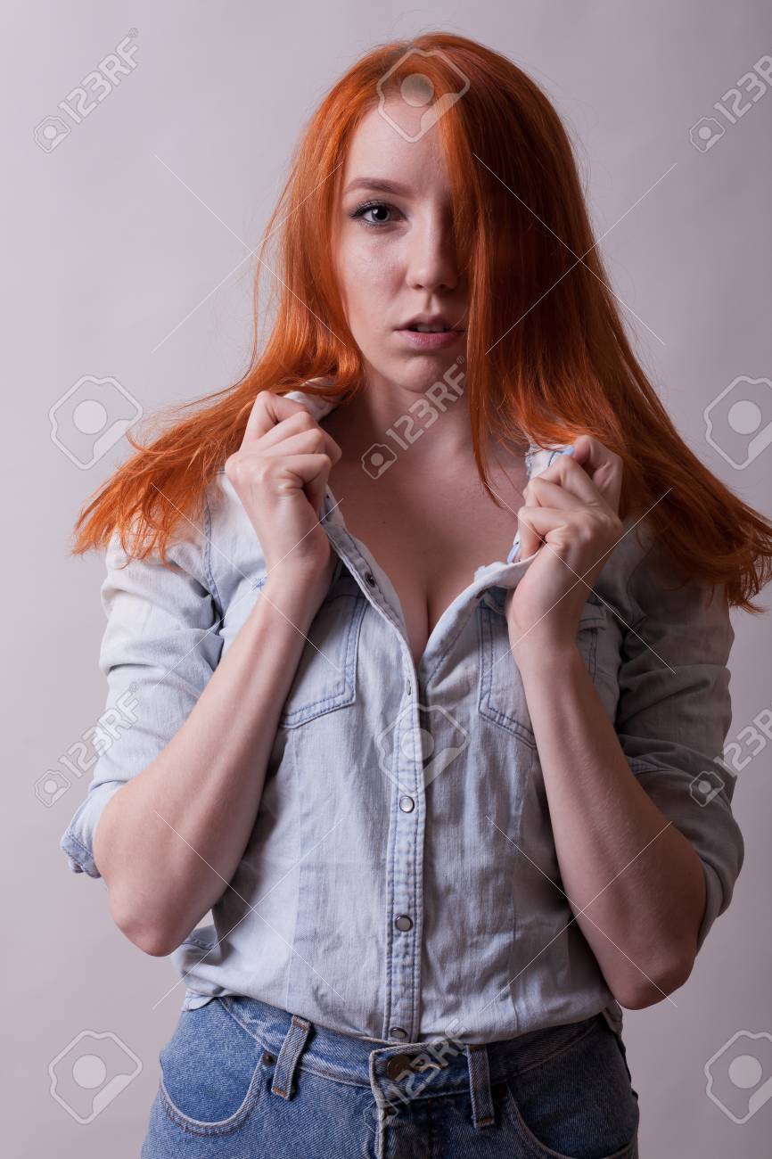 Photographer Dragos CondreaAmazing Busty Redhead Woman In Studio