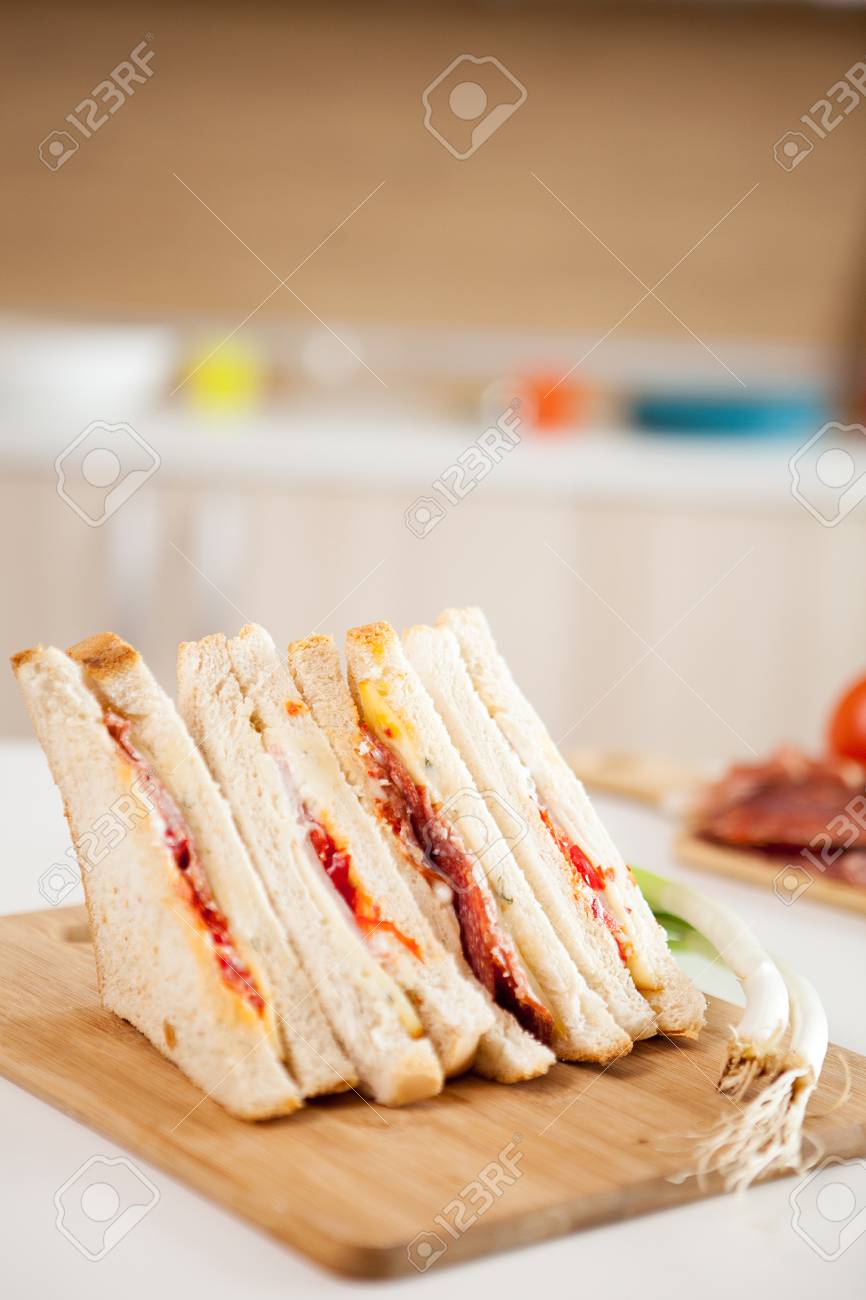 Club Sandwich With White Bread On The Kitchen Stock Photo Picture