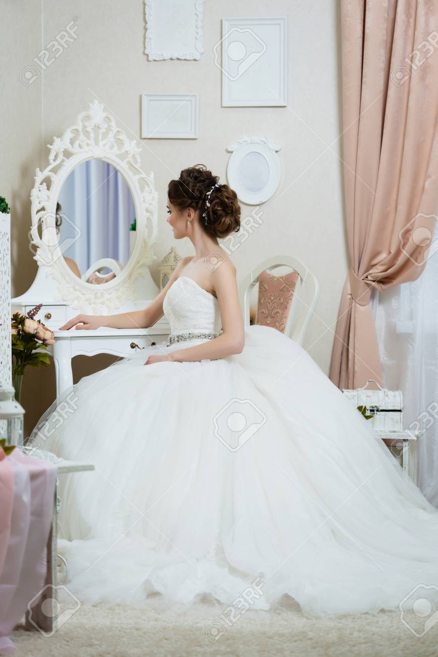 Beautiful Young Bride In Front Of The Mirror Portrait With Wedding
