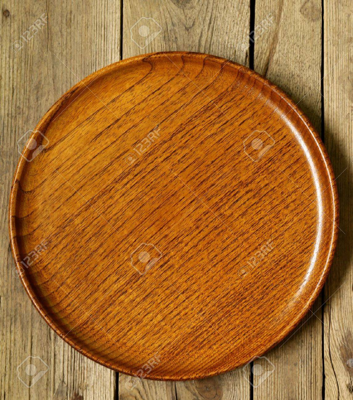 empty wooden plate on the old wooden table stock photo picture and