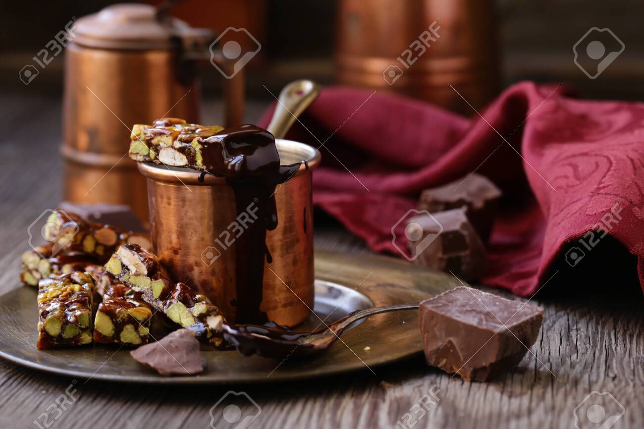 hot chocolate with nutty roasted nuts for dessert - 132749734 hot chocolate with nutty roasted nuts for dessert - 132749734