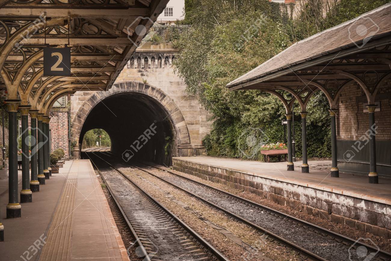 an old victorian era train station and platform still in use