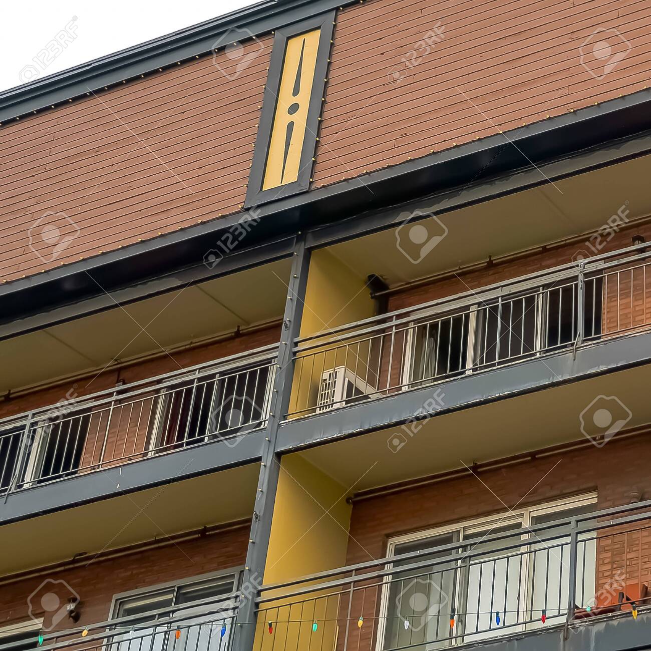 Square Residential Building With Flat Roof Balconies And Red