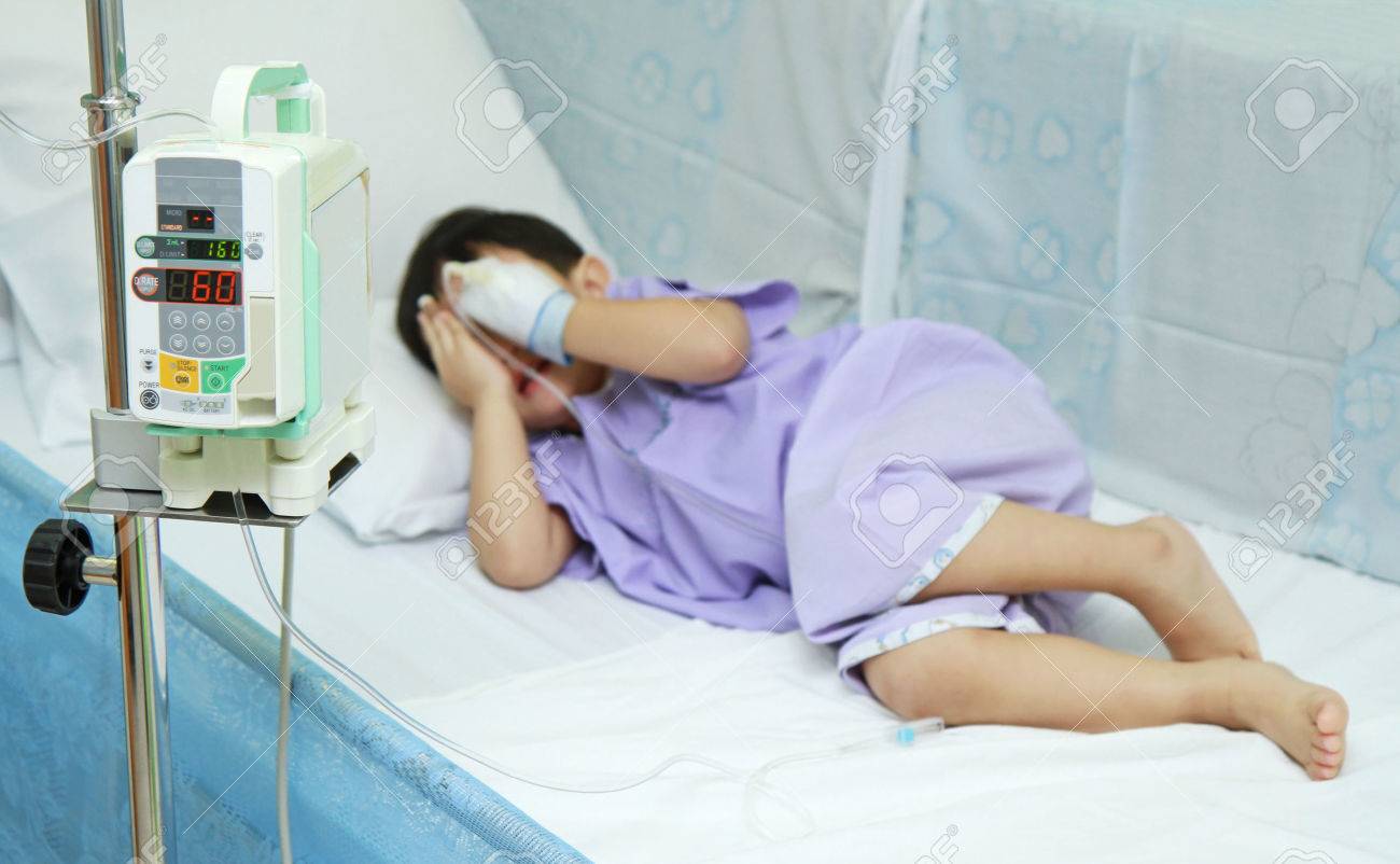 Children Patient Closing His Face In Hospital Bed Stock Photo ...